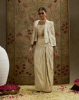 Magnolia Cream Embellished Butta Cape Jacket Paired With Metal Embellished Bustier And Slit Skirt