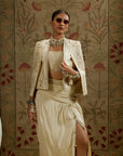 Magnolia Cream Embellished Butta Cape Jacket Paired With Metal Embellished Bustier And Slit Skirt