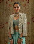 Metallic Cape Jacket Paired With Metallic Bustier And Embellished Pleated Pants